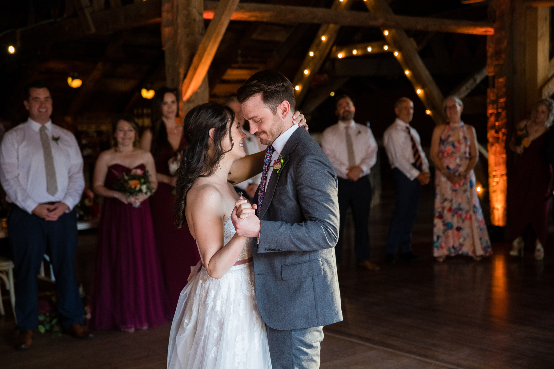 The bride and groom sharing a dance in the renovated barn at Blenheim Hill Farm
