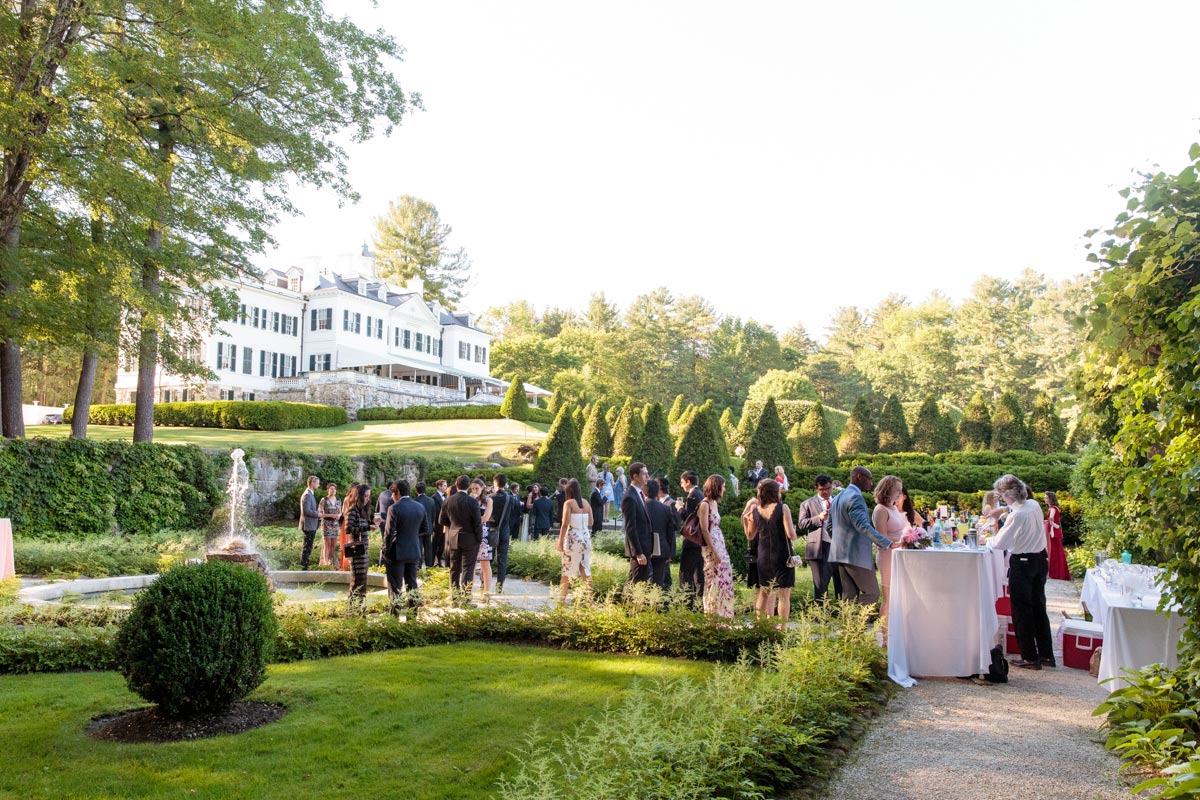 Guests sipping on cocktails and mingling in The Mount's intimate Italian Garden.