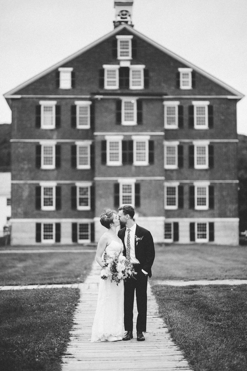 a couple kissing during their hancock shaker village wedding 