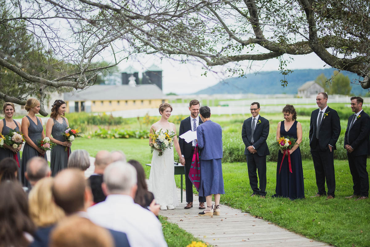 Wedding ceremony under the apple tree at hancock shaker village