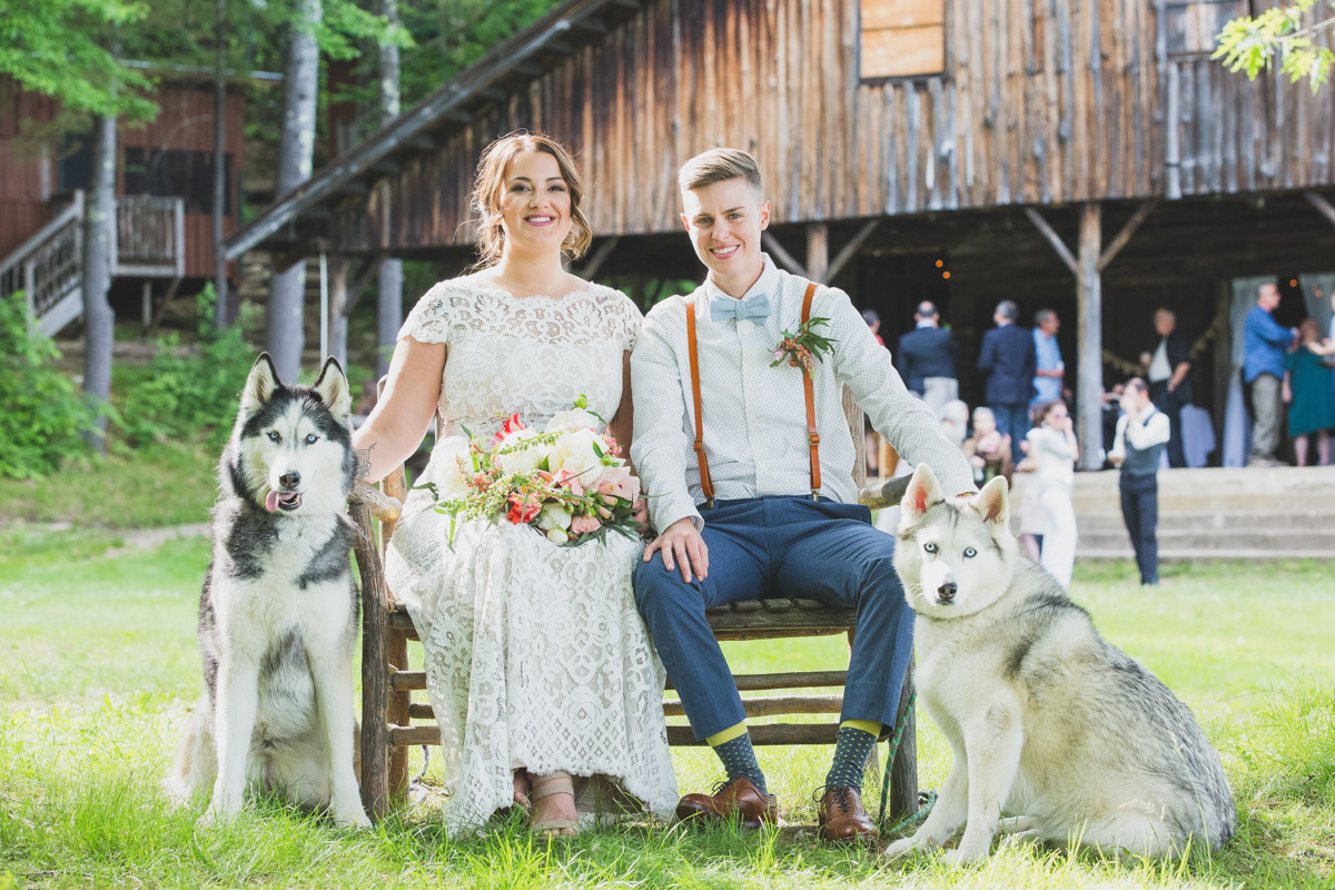 two brides with their dogs