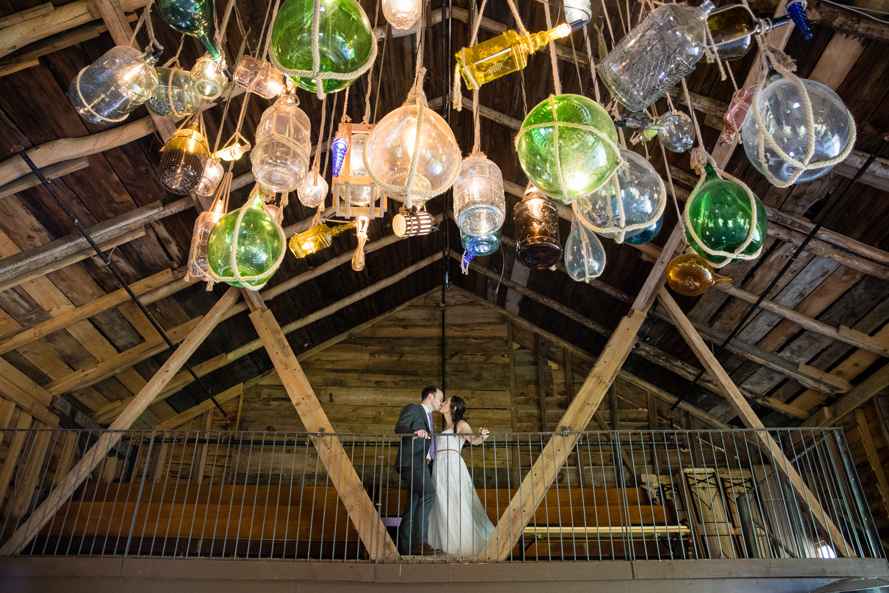 Bride and groom kissing during their wedding at Blenheim Hill Farm