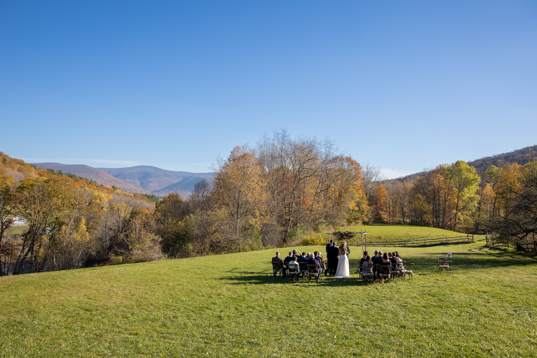 panoramic view of a wedding ceremony at the Brookman Estate with Mt. Greylock in the background