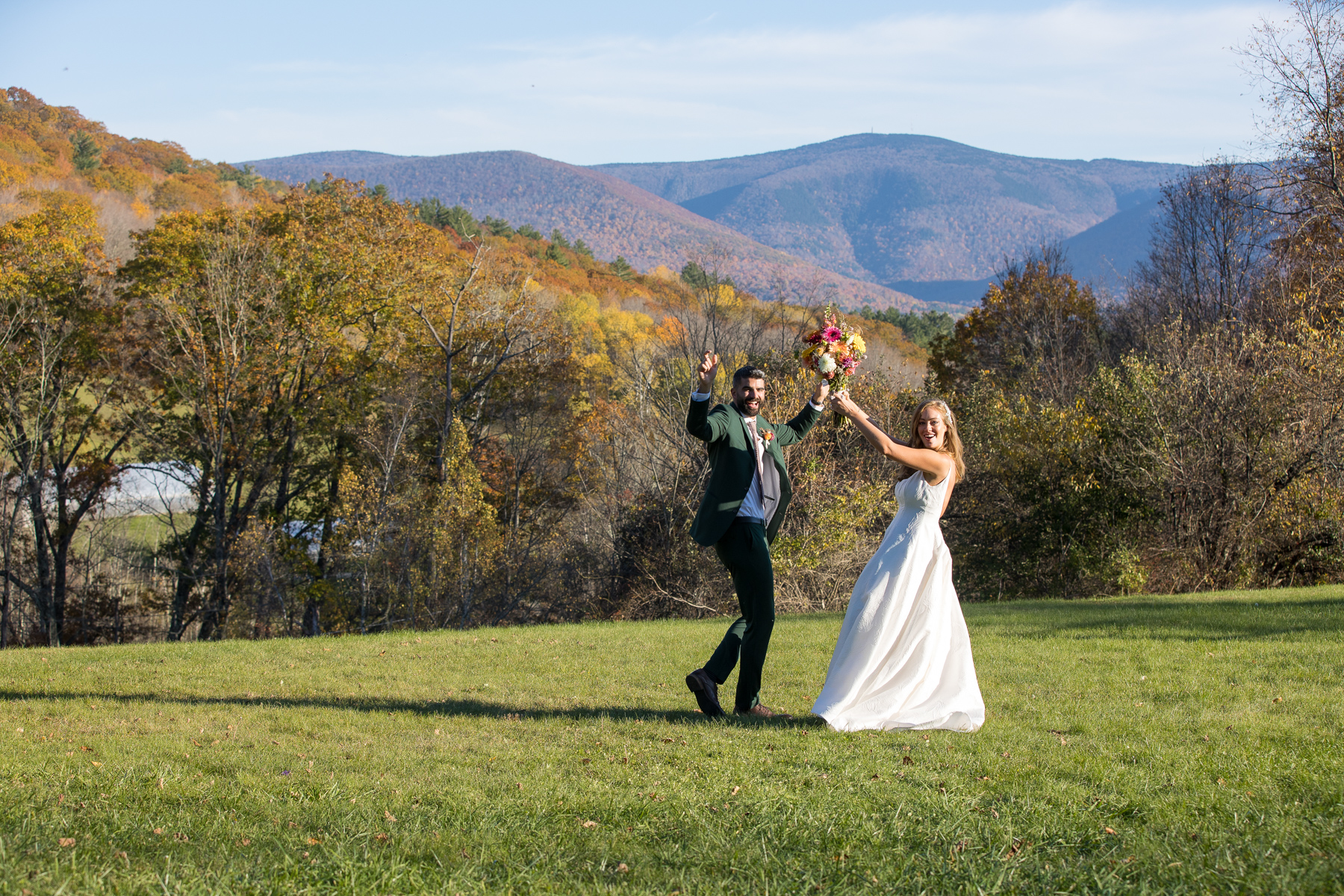 bride and groom with mount Greylock in the background