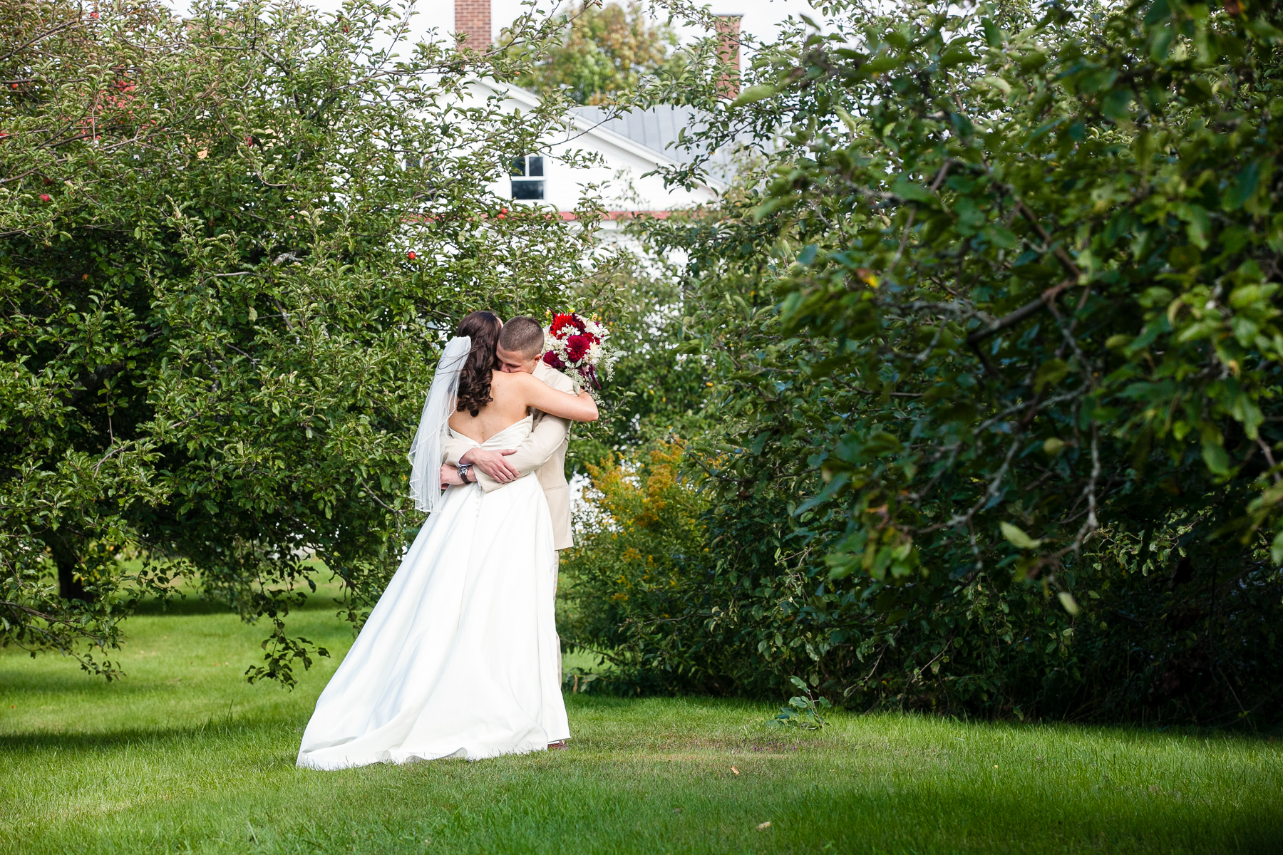 Bride and Groom in the apple orchard at hancock shaker village