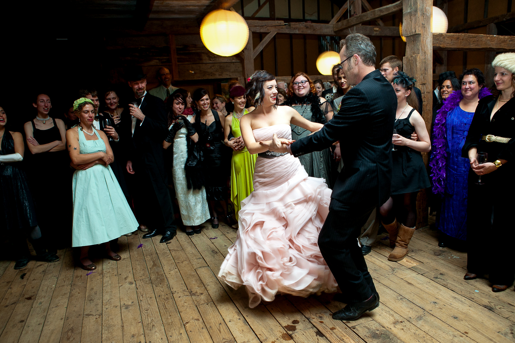 the bride and grooms first dance in the barn at race brook lodge