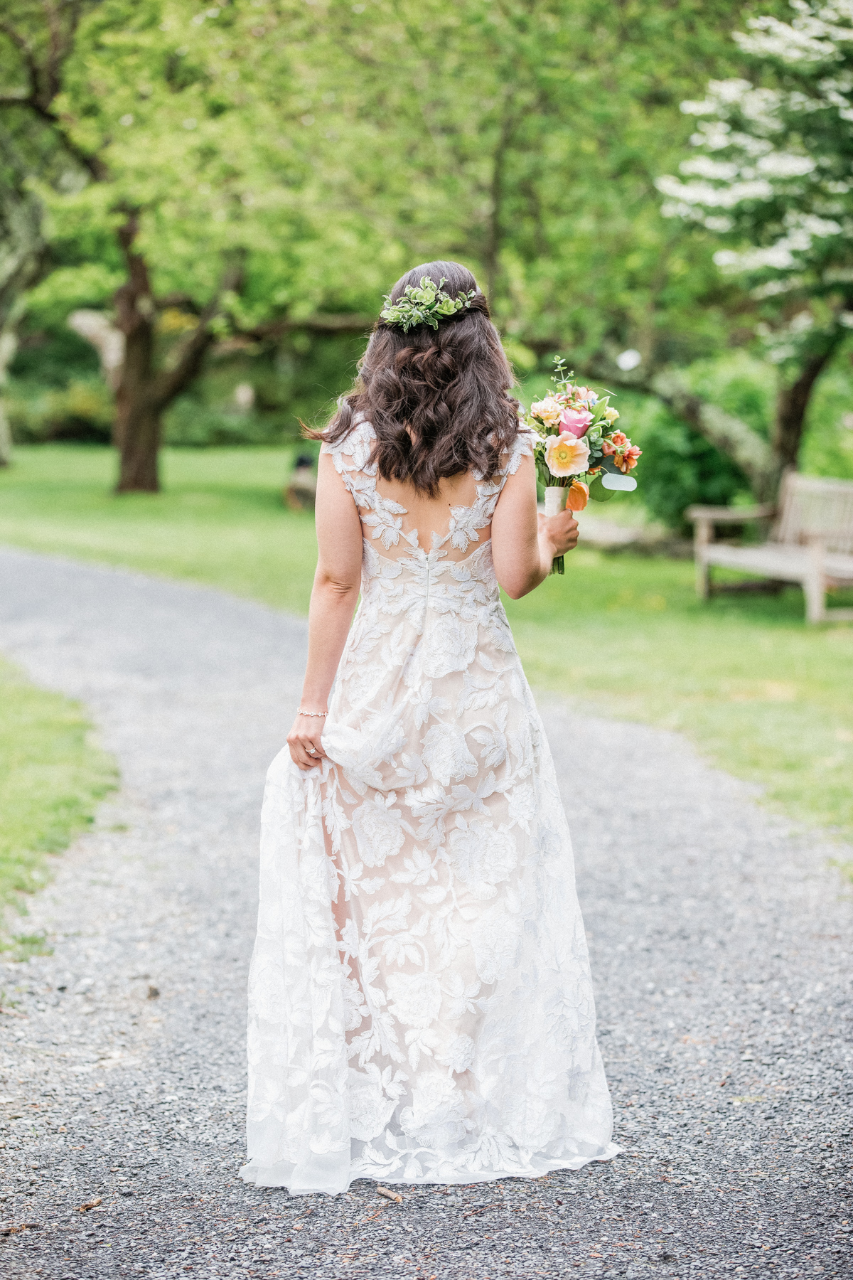 a bride walking away from the camera at the Berkshire Botanical Gardens