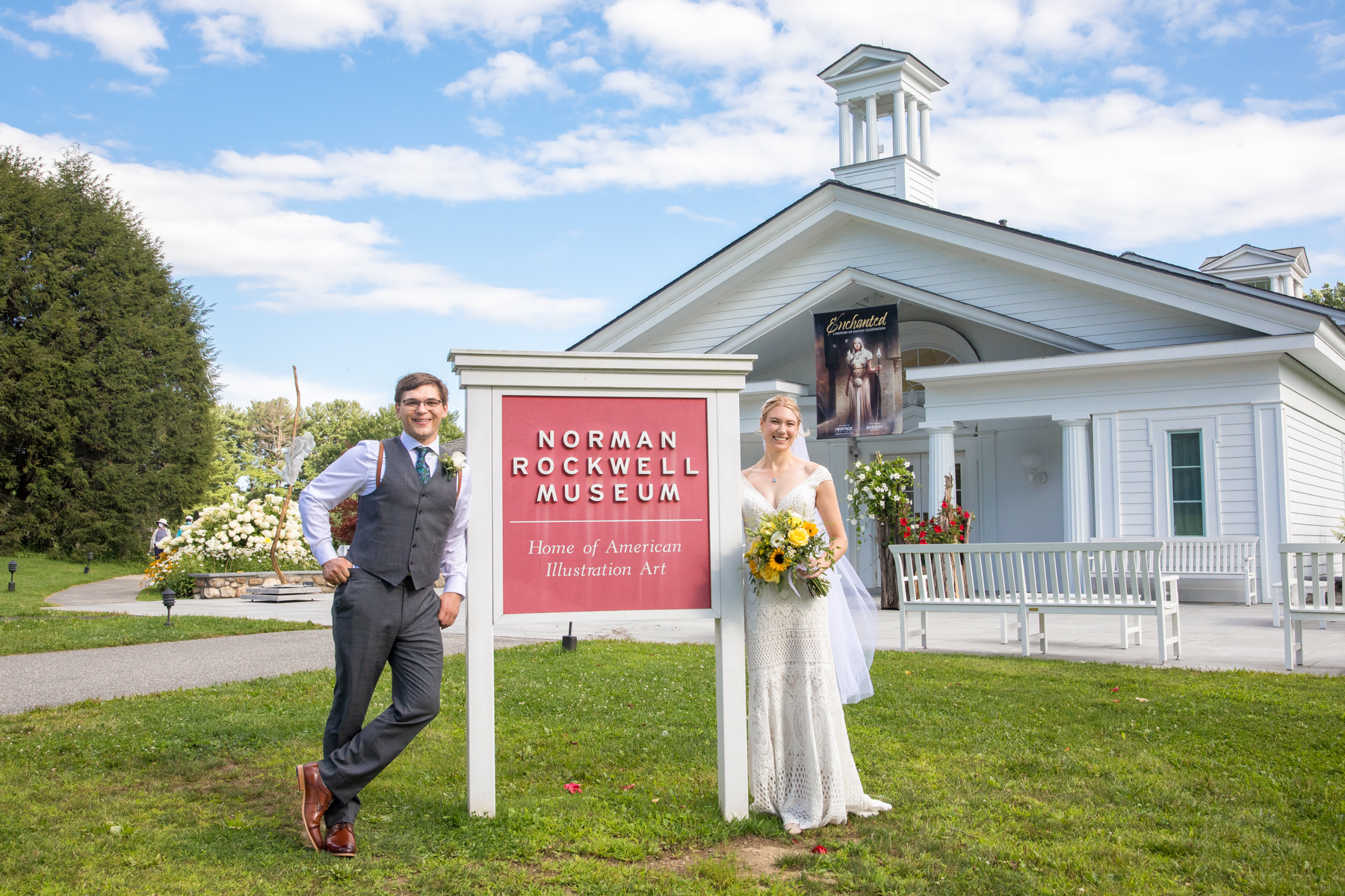bride and groom standing outside the Norman Rockwell Museum