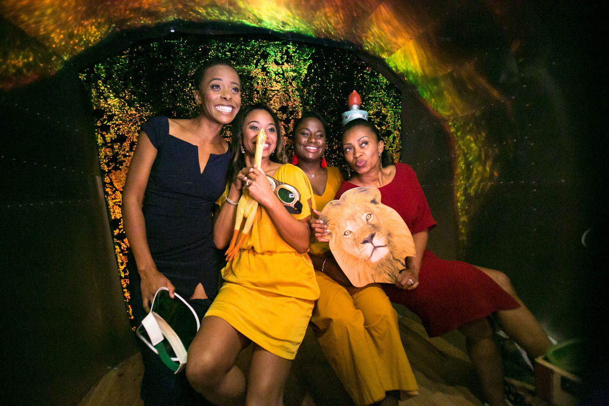 Four bridesmaids are inside the Airstream photo booth, sharing a fun and lively moment. With playful props and beaming smiles, they’re enjoying the festive spirit of the wedding.