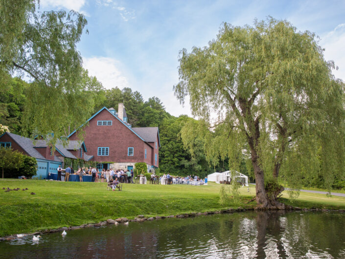 Manicured lawn by the duck pond at Stonover Farm, set for a champagne reception