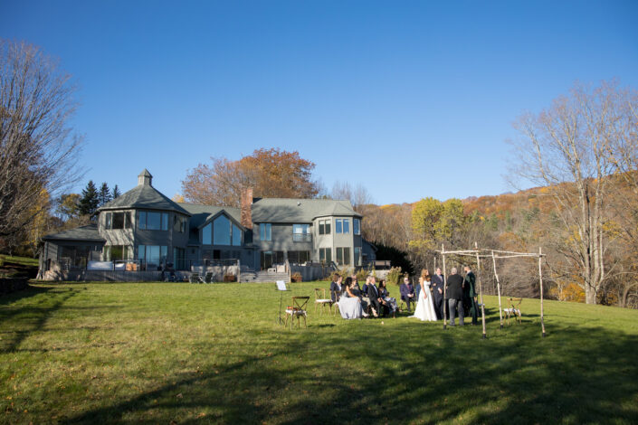 wedding ceremony in the lawn at the brookman estate